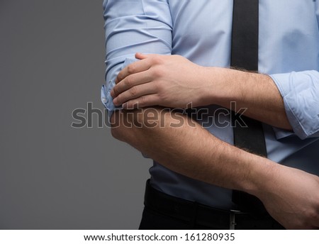 Close up of man hand throwing sleeve. Looking fashionable and classy