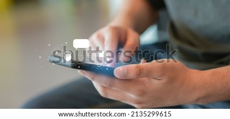 close up man hand use smartphone to contact provider and talk with ai chatbot software program for business marketing concept