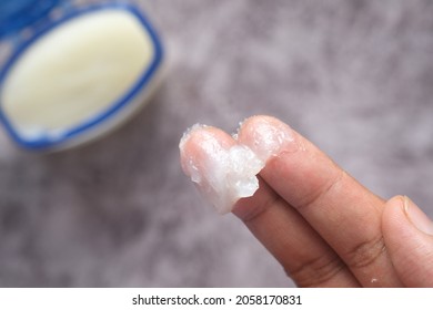  Close up of man hand using petroleum jelly 