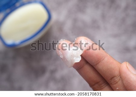  Close up of man hand using petroleum jelly 