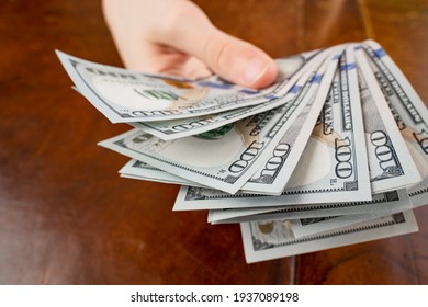 close up of man hands counting us dollar money