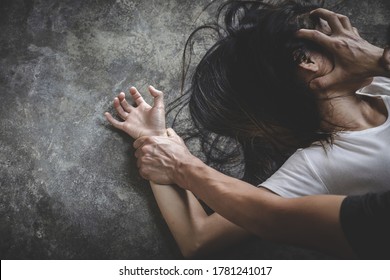 Close up of man hands holding a woman hands for rape and sexual abuse concept, Wound domestic violence rape, sexual assault, stop violence against women, human trafficking.