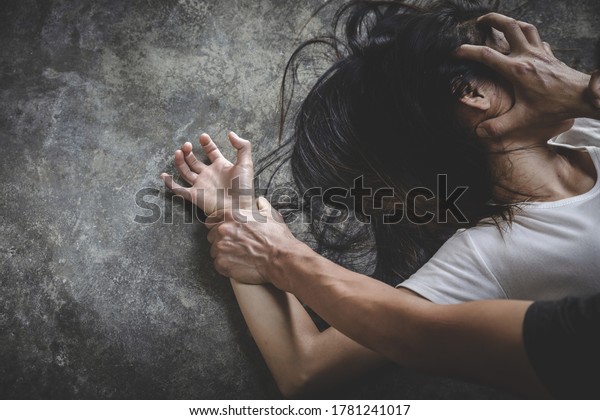 Close up of\
man hands holding a woman hands for rape and sexual abuse concept,\
Wound domestic violence rape, sexual assault, stop violence against\
women, human\
trafficking.\