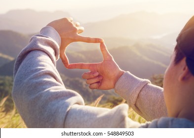 Close Up Of Man Hands Making Frame Gesture With Sunrise On Moutain, Male Capturing The Sunrise, Future Planning, Sunlight Outdoor.