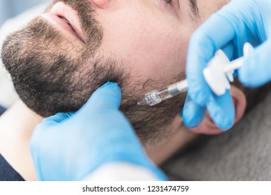 Close Up Of Man Having Hyaluron Fillers On Jaw And Ching.