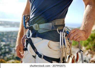 Close Up Of A Man In His Harness And Rock Climbing Equipment