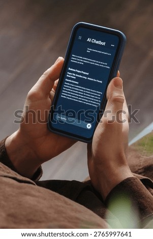 Close up of a man holding a smartphone, using an AI chatbot app for work, brainstorm a business project. Personal Artificial intelligence assistant helping with productivity. Vertical photo