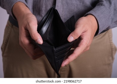 Close Up Man Holding Wallet. Have No Money Concept Of No Job No Money, Recession, Great Depression, Joblessness, Unemployment, Unemployed People, Layoff, Financial Problem, Financial Crisis, Job Cut.