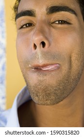 Close Up Of Man Licking Lips