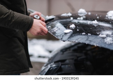 Close Up Of Man Open Snowy Hood Of The Car, Winter Outdoor