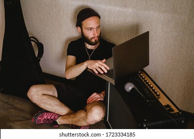 Close Up Of Man Playing Amplified Electro Guitar. Amp With An Electric Guitar