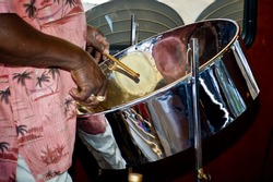 Close Up Of Man Playing A Steel Drum