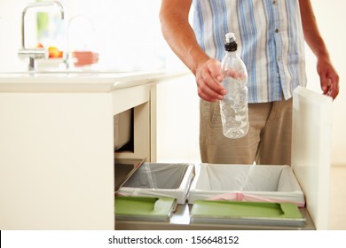 Close Up Of Man Recycling Kitchen Waste In Bin