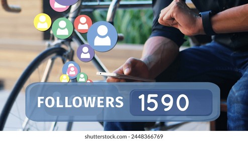 Close up of a man seated beside a bicycle typing on his phone while checking his wrist watch. Digital image of a followers count bar with icons flying upwards is seen in the foreground.