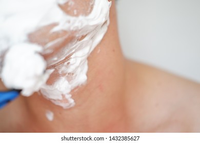 close up man of shaving on face isolated background - Shutterstock ID 1432385627
