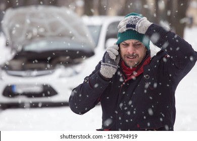 Close Up Of Man In Snow, He Is Under Stress Because His Broken Down Car.