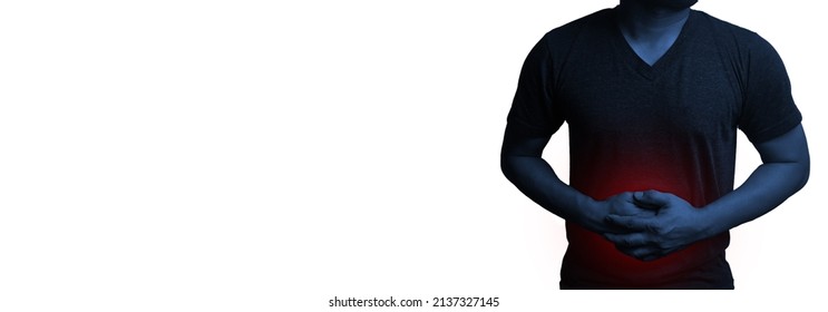 Close Up A Man Stomach Ache And Holding Hand On Abdominal Area On Red Mark Medical Healthcare Concept.dark Tone Process.with Clipping Paths.