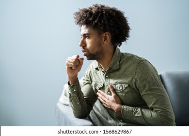 Close Up Of Man Suffering With Cough