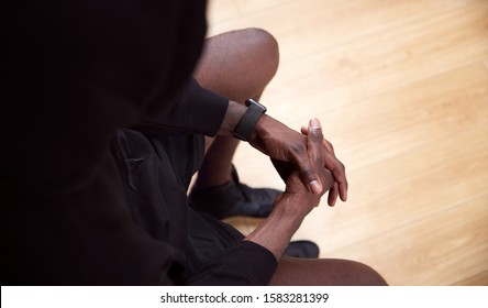 Close Up Of Man Training In Gym Using App On Smart Watch To Track Performance