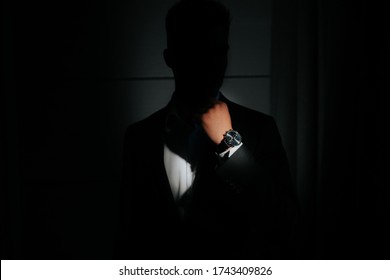 Close Up Of Man In Trendy Suit With Expensive Watch On Arm. Rich Man Concept. Wristwatch On Man's Hand Highlighted With Light. Business Man. Watch Advertisement Concept. 