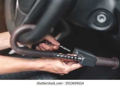 Close up of man use key locking steering wheel for security, Anti thief steal a car, Selective focus.