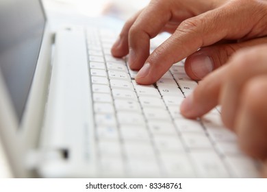 Close up man using computer keyboard