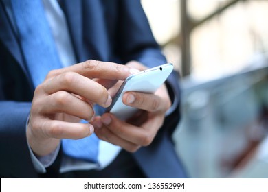 Close up of a man using mobile smart phone - Shutterstock ID 136552994