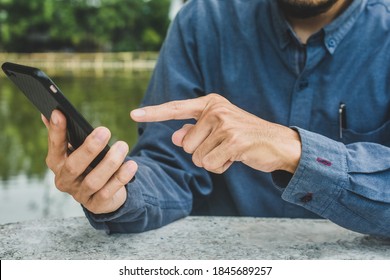 Close up man using mobile smart phone ,business, people, cellphone, touchscreen, touchphone, cell, businessman, smartphone, phone, telephone, lifestyle, technology, device - Shutterstock ID 1845689257