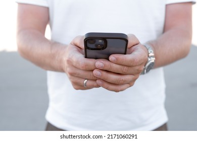 Close up of a man using mobile smart phone