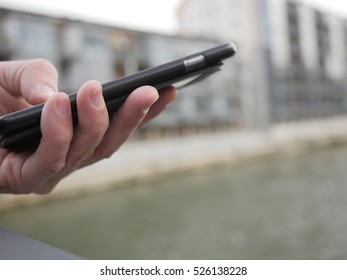 Close up of a man using mobile smart phone