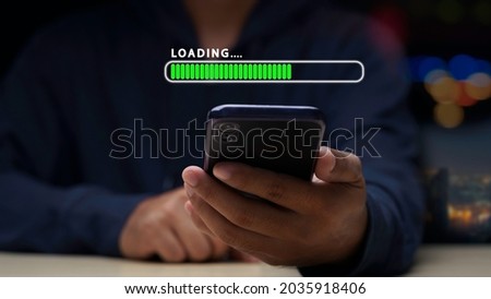Close up man using mobile smartphone for download application and waiting to loading. loading bar symbol. businessman downloading digital business data form website and cloud to smartphone.