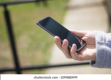 Close up of man using smart phone. 