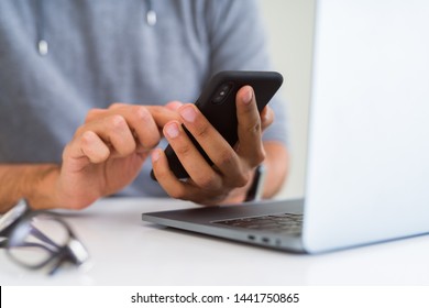 Close up of man using smartphone