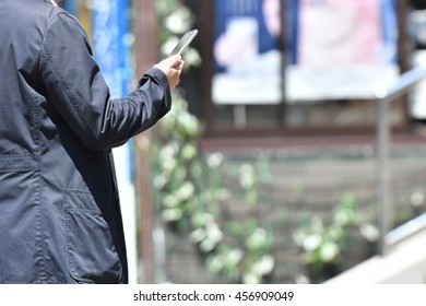 Close up of a man using smartphone
