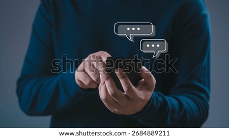 Close up of man using smartphone with chat message icons, concept of online communication, mobile messaging, digital technology, social networking, instant chat apps, and modern lifestyle connection.