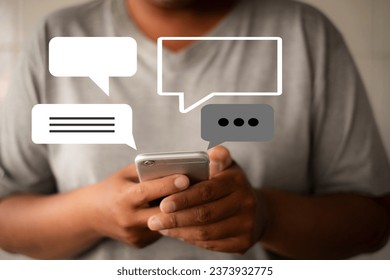 Close up man using smartphone with speech bubbles icon concept for social media,technology. - Powered by Shutterstock