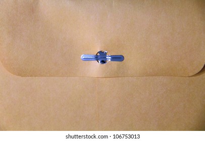 Close Up Of A Manila Envelope With Metal Clasp.