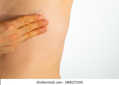 Close Up Of A Man's Chest Looking For Signs Of Male Breast Cancer