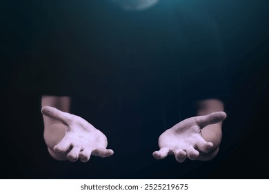 Close up of man's hands reaching out in the dark. Man's hands are open, creating a sense of offering or holding. Empty hands of man, man gesture. Man's hands holding something on dark background.