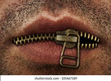 Close up of man's mouth with bronze or gold metal zipper closing lips shut.