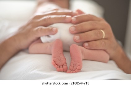 Close Up Man's Strong Hands Gently Holds Baby. Newborn Sleeping Soundly And Peacefully On Man Belly. Birth Kid - Happiness For Family. New Worries And Style Life. Concept Of Child Care, Parent Love.