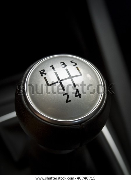 close up\
of a manual car gear shift. 6 speed\
manual.