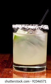 Close Up Of A Margarita Garnished With A Fresh Lime And A Salt Rim Around The Glass