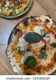 Close Up Margarita Pizza Served With Nacho Salad