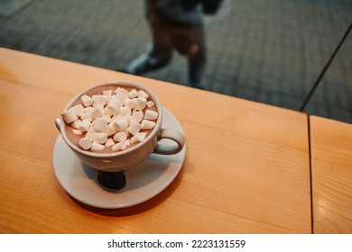 Close up marshmallow with milk coffee cacao or latte. Hot aromatic chocolate beverage in white ceramic mug. Warming snack food in street cafe. Winter drink - Powered by Shutterstock