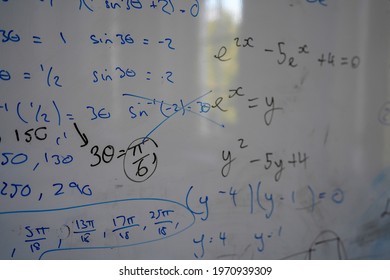 Close up of math, graphs and equations on a white board