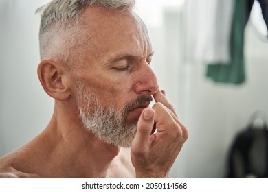 Close Up Of Mature Man Sniff Something With Nose