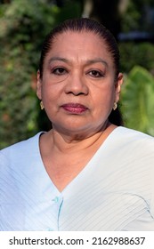 Close Up Of Mature Mexican Lady Looking At The Camera. Mature Latina Woman Looking At The Camera. Serious Attitude.