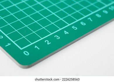 close up measuring number on green suremark cutting or cutting mat isolated in white - Shutterstock ID 2226258563