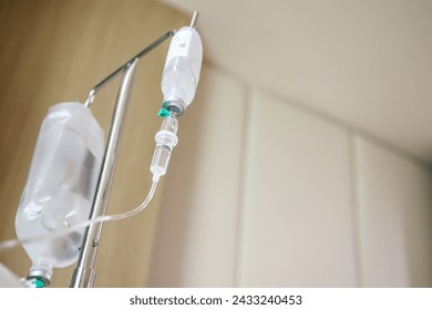 Close up medical intravenous IV drip in hospital background - Powered by Shutterstock